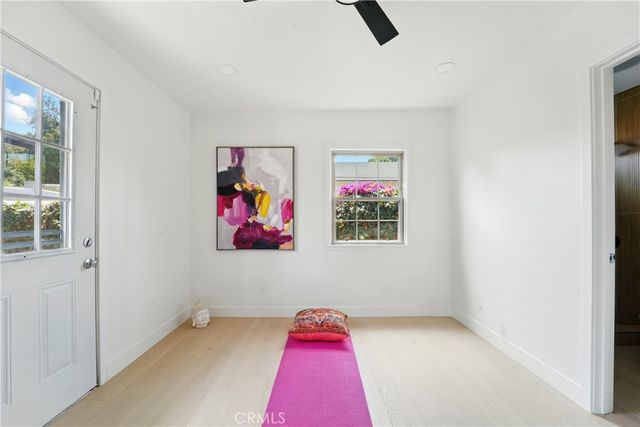 a view of a room with a ceiling fan