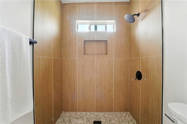 a bathroom with a sink toilet and a mirror