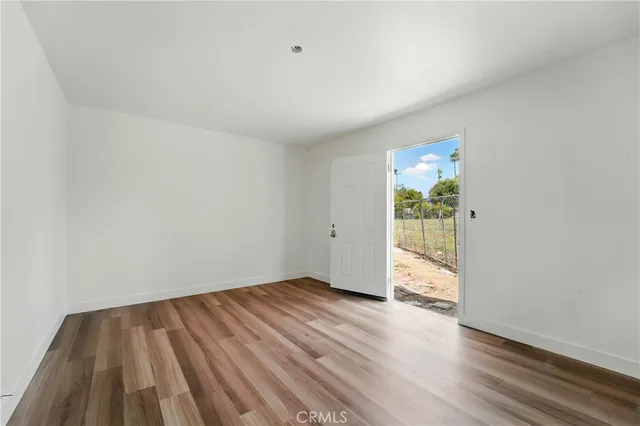 a view of a room with wooden floor and walls