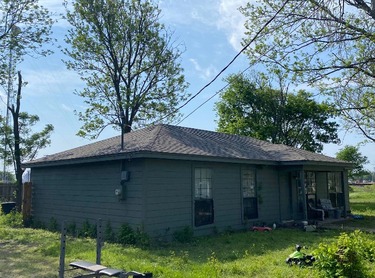 15 South 19th Street Temple, TX 76504 - Photo 3 of 13 a view of a brick house with a small yard