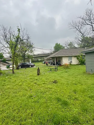 a swimming pool with outdoor seating and yard