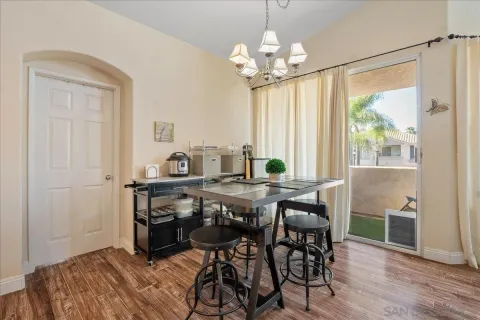 a view of a dining room with furniture window and outside view
