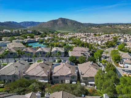 an aerial view of residential houses with outdoor space