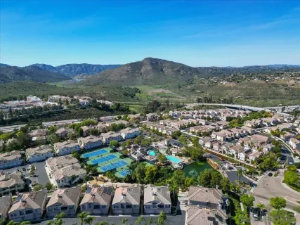 an aerial view of residential house and green space