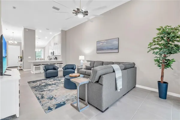 a living room with furniture and a rug