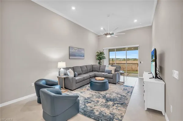 a large white kitchen with a sink and cabinets