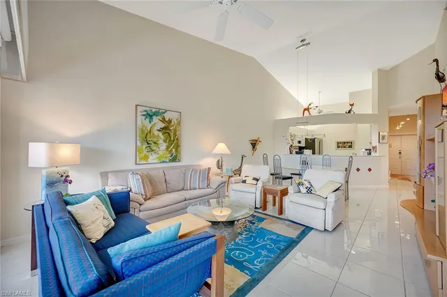 a living room with furniture and a lamp