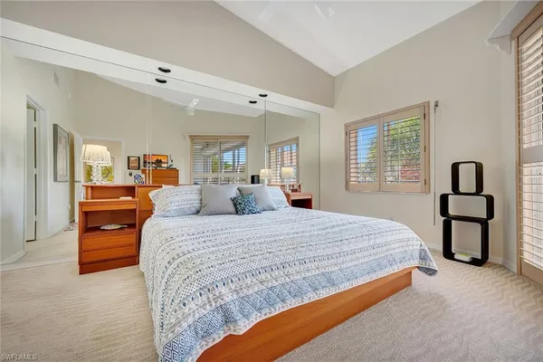 a bedroom with bed and window