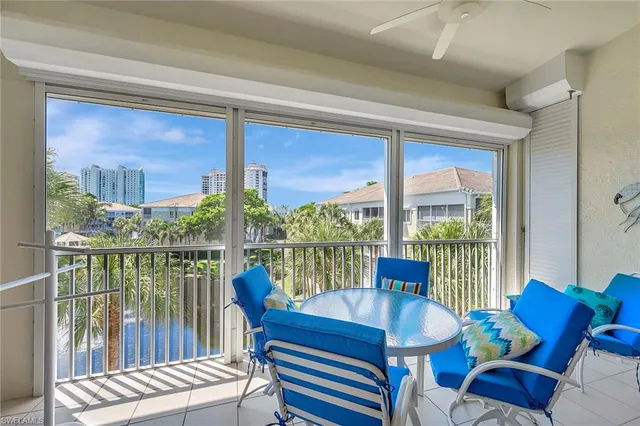 a view of a living room and a floor to ceiling window