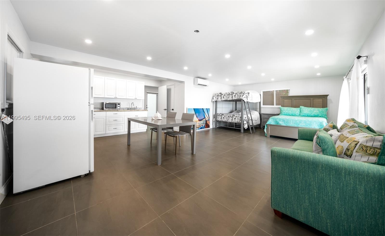 188 Orange Blossom Road Tavernier, FL 33070 - Photo 33 of 41 a living room with furniture and a view of kitchen