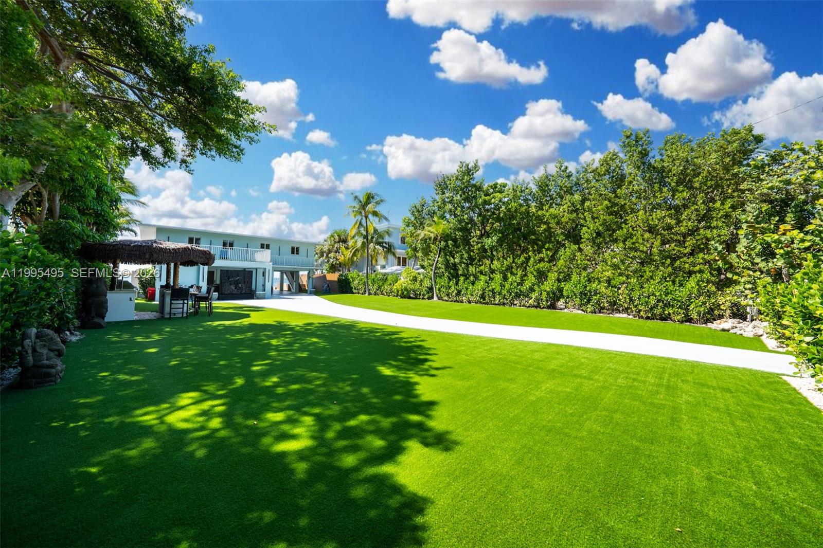 188 Orange Blossom Road Tavernier, FL 33070 - Photo 41 of 41 a view of a house with a yard