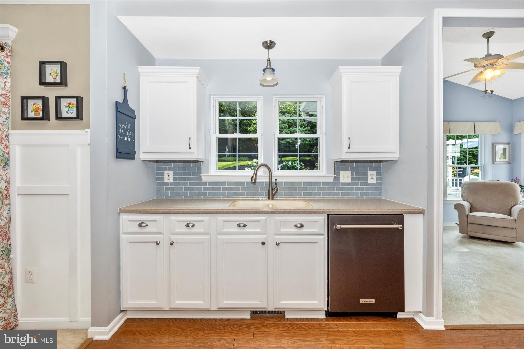 3137 Pyramid Circle Manchester, MD 21102 - Photo 25 of 55 a kitchen with granite countertop a stove a sink and a window