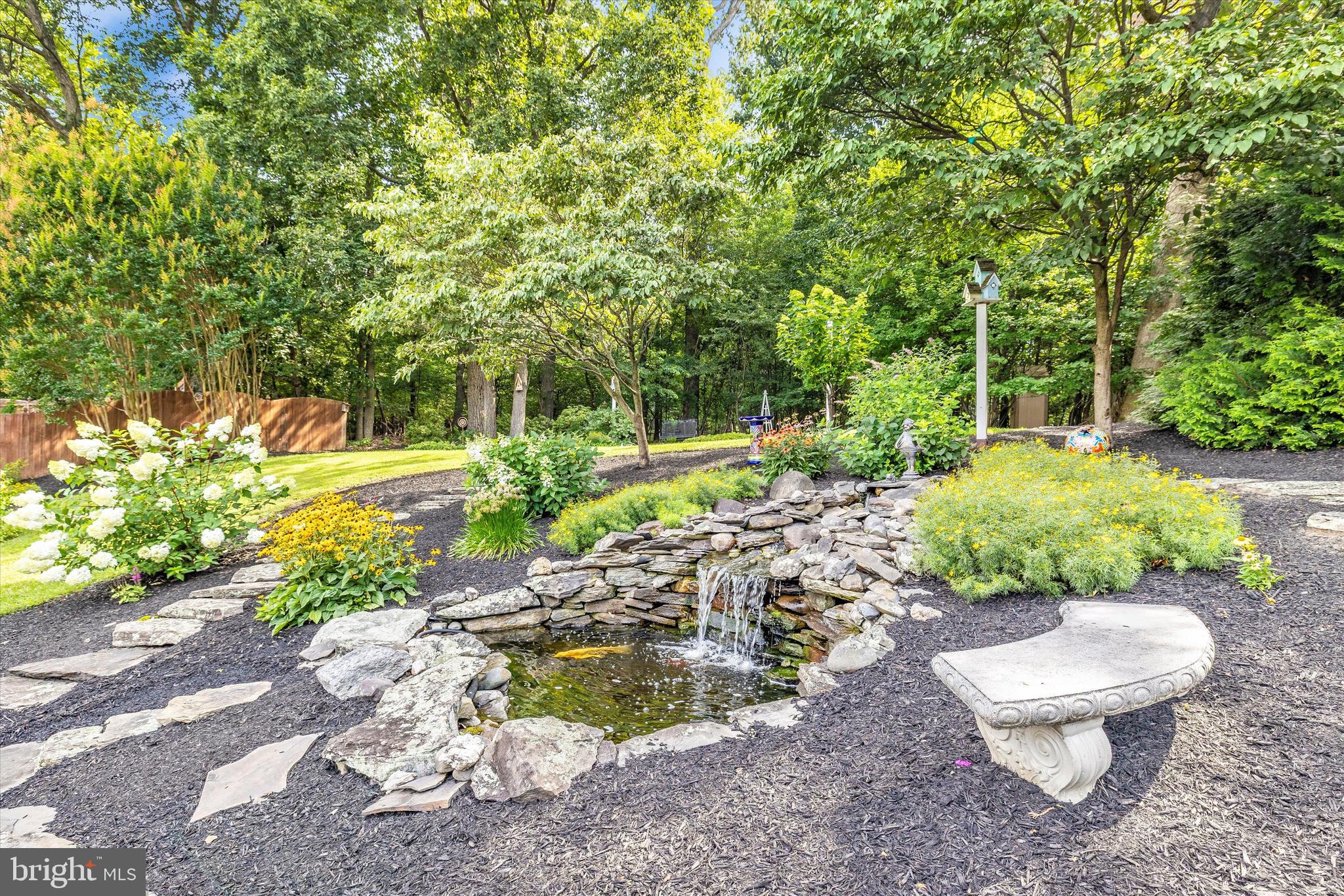 3137 Pyramid Circle Manchester, MD 21102 - Photo 35 of 55 a view of a backyard with potted plants and large trees
