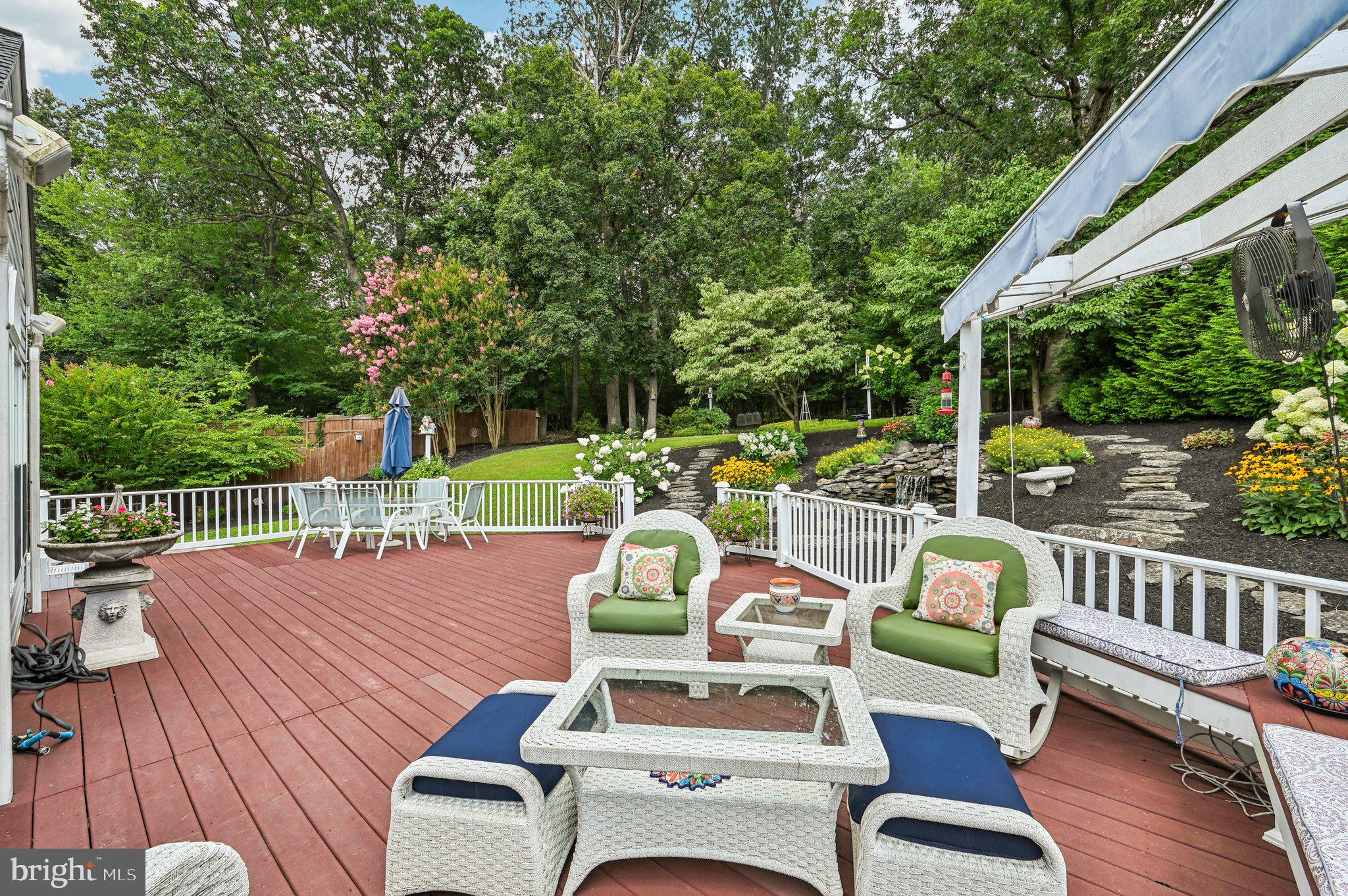 3137 Pyramid Circle Manchester, MD 21102 - Photo 39 of 55 a view of a patio with couches table and chairs and wooden floor