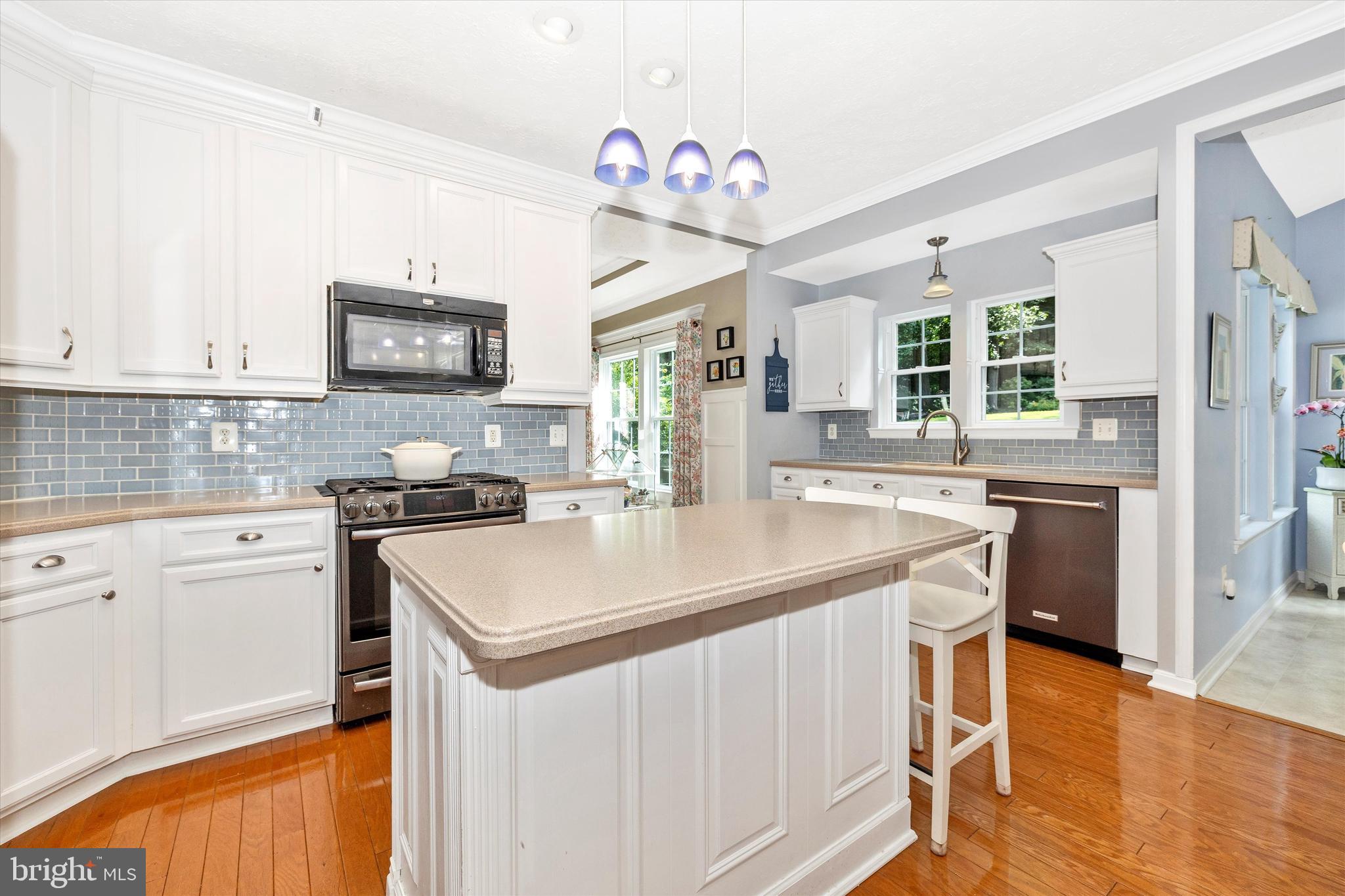 3137 Pyramid Circle Manchester, MD 21102 - Photo 6 of 55 a kitchen with a stove a sink and a refrigerator