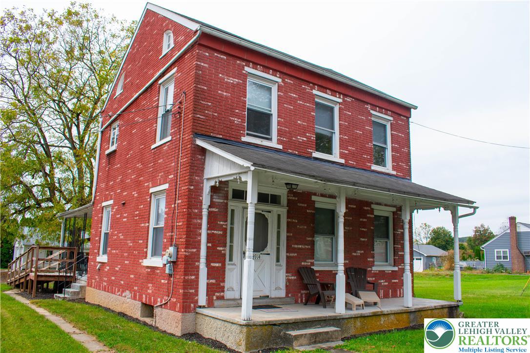 3914 Mauch Chunk Road Coplay, PA 18037 - Photo 1 of 8 front view of a building with a garden