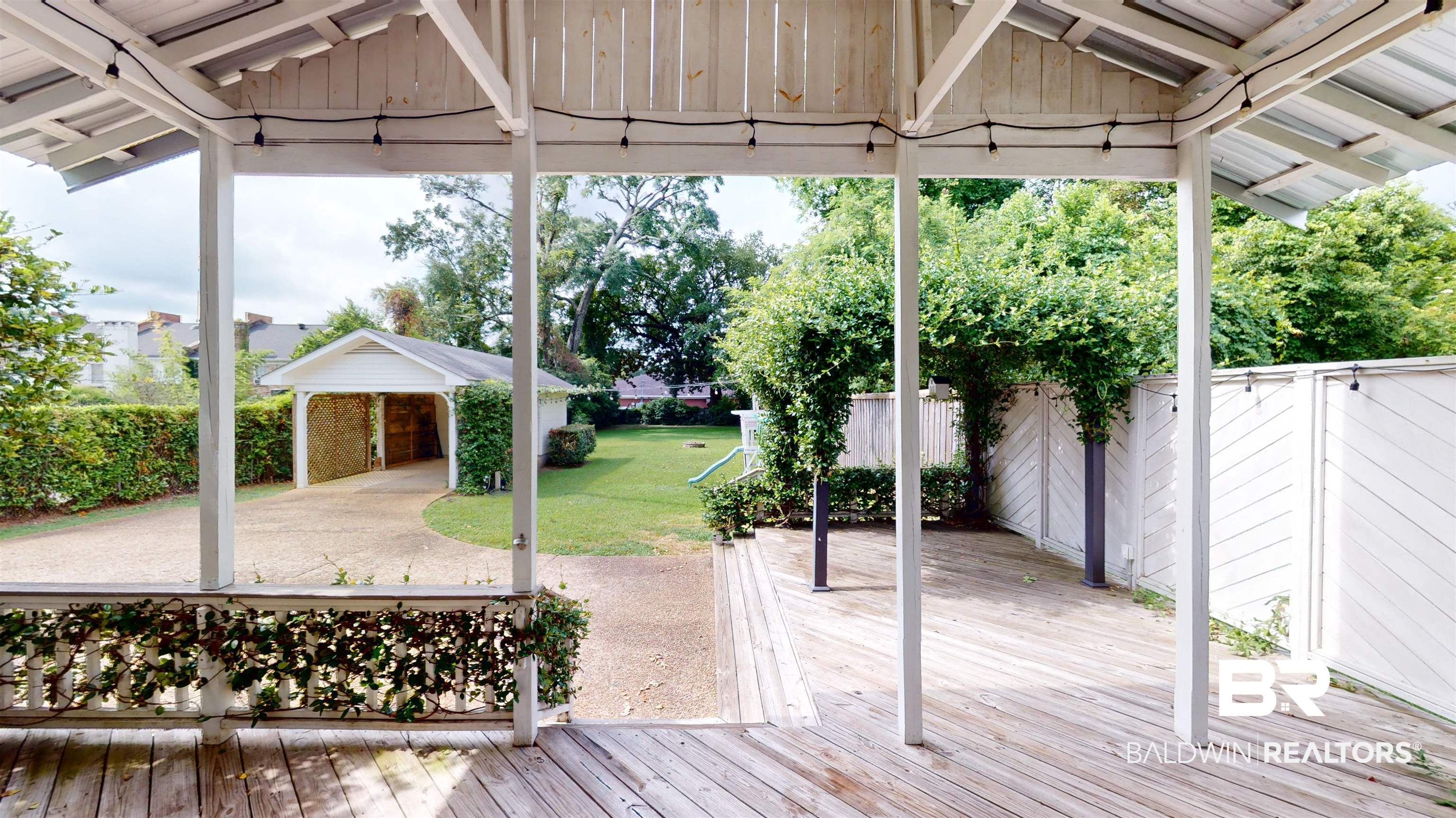 4307 Stein Street Mobile, AL 36608 - Photo 22 of 28 Wooden terrace with a patio area, a gazebo, and a lawn