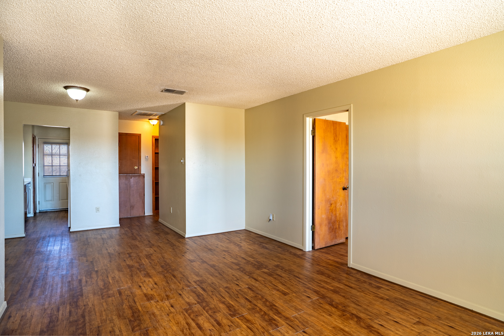 112 Blue Ridge Comfort, TX 78013 - Photo 3 of 11 wooden floor in an empty room with a window