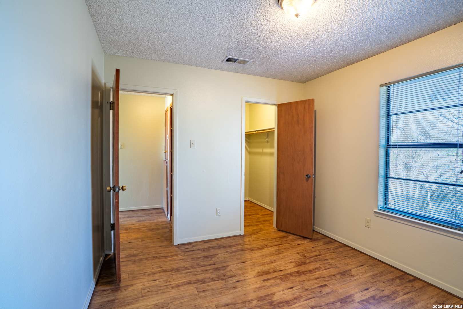 112 Blue Ridge Comfort, TX 78013 - Photo 9 of 11 wooden floor in an empty room with a window