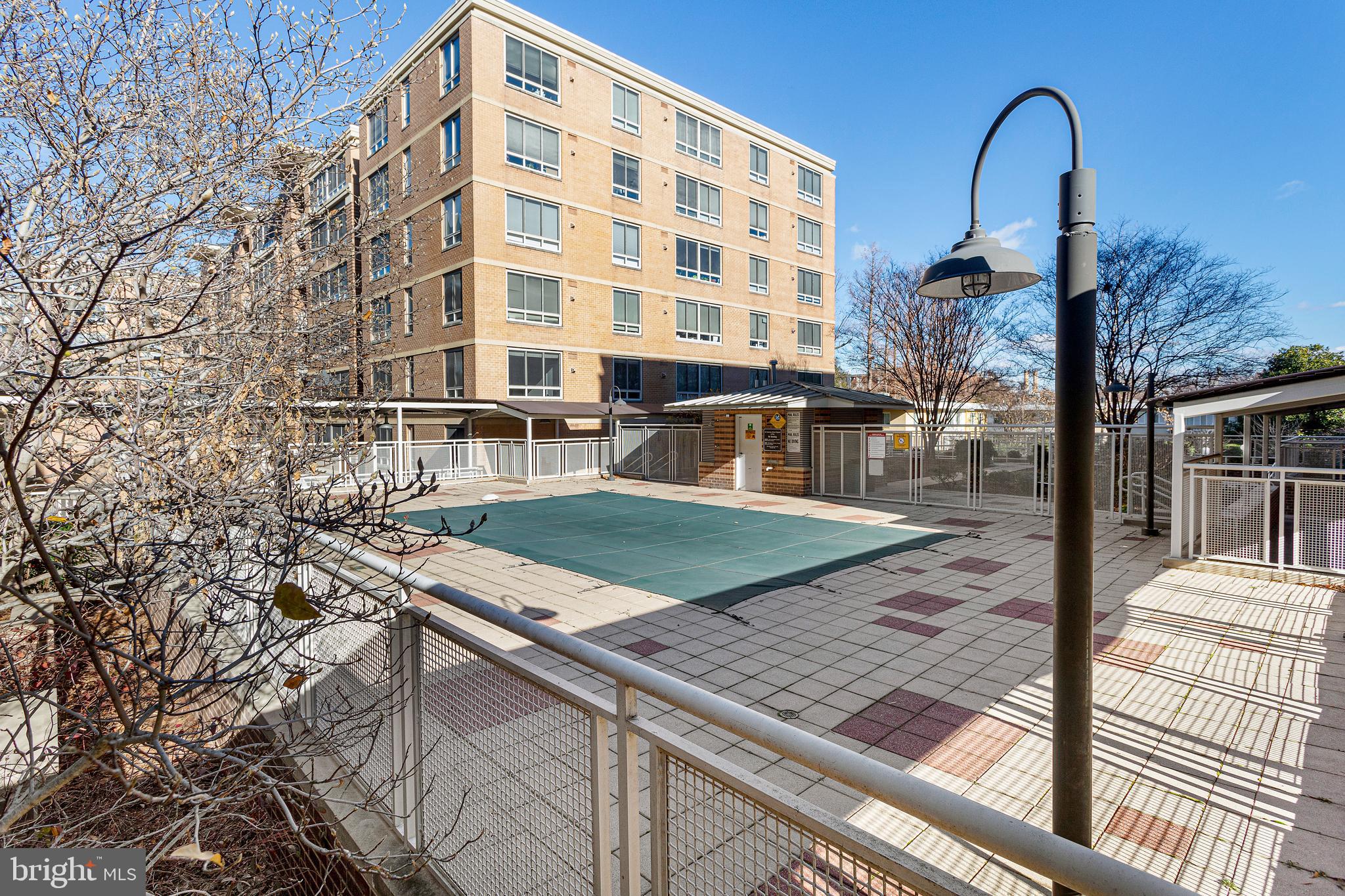 800 4th Street Southwest, Unit S425 Washington, DC 20024 - Photo 26 of 27 a view of a swimming pool with a patio