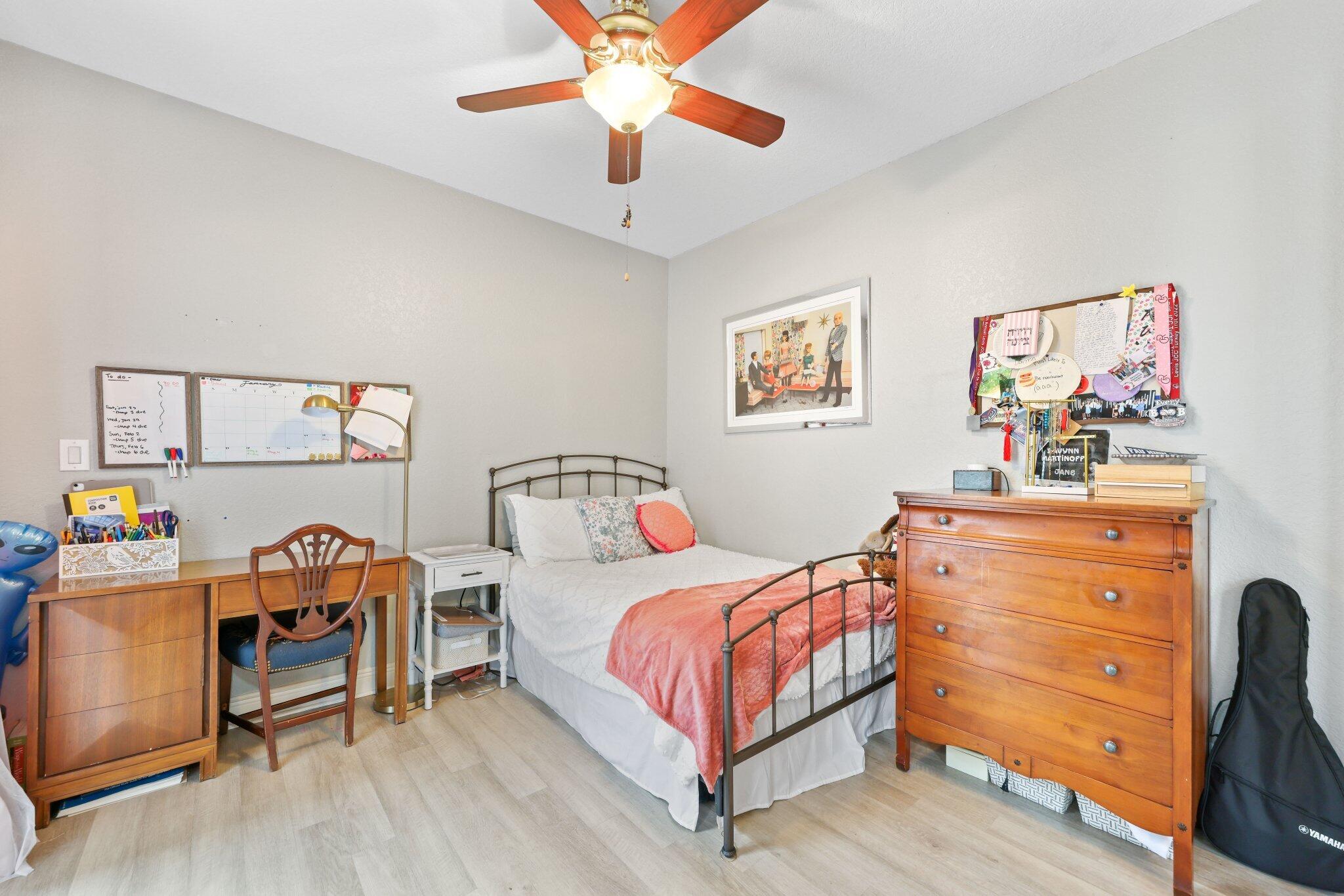 19090 Skyridge Circle Boca Raton, FL 33498 - Photo 27 of 70 a bedroom with a bed and a dresser in it