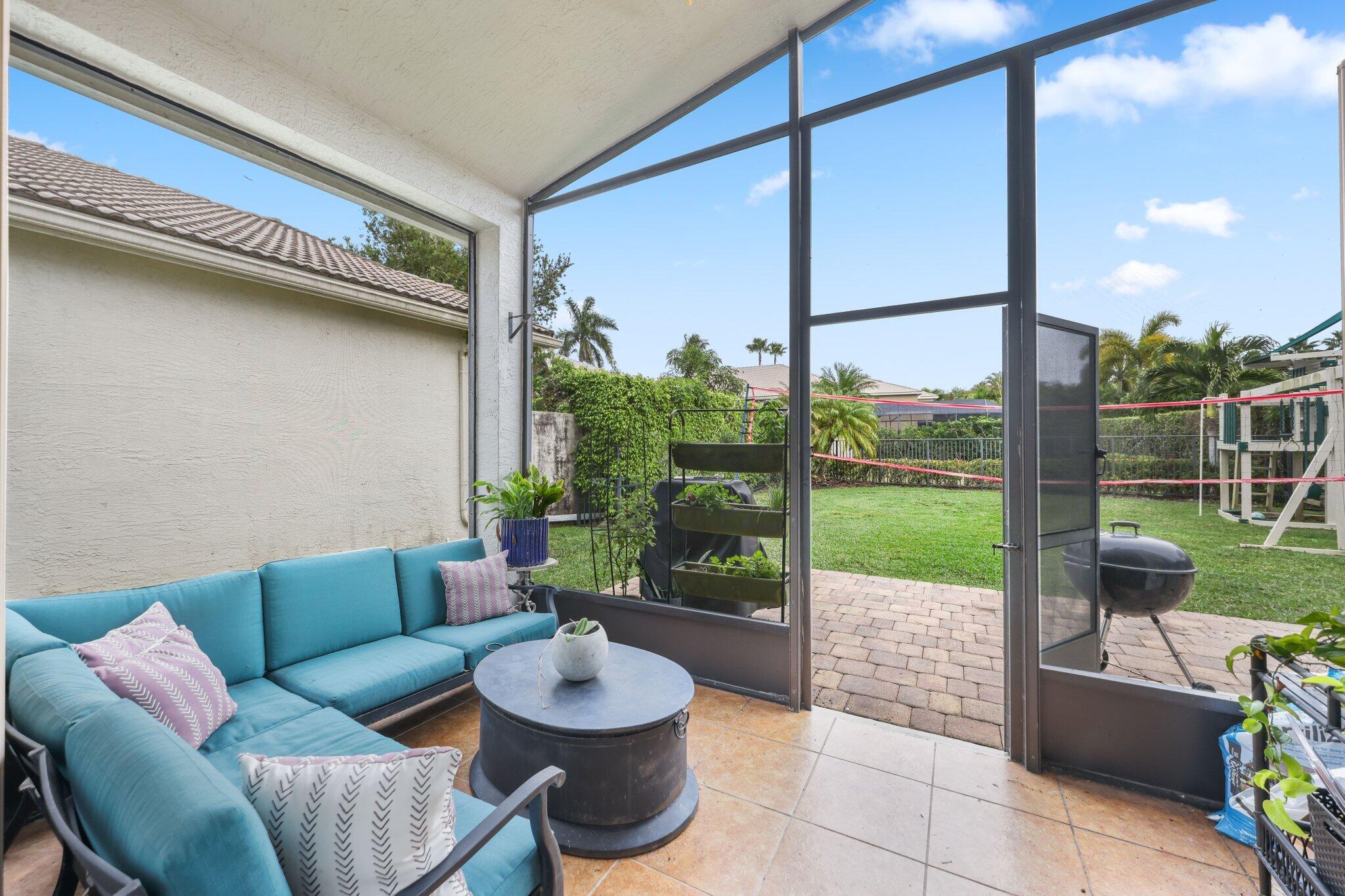 19090 Skyridge Circle Boca Raton, FL 33498 - Photo 34 of 70 a living room with furniture and a floor to ceiling window
