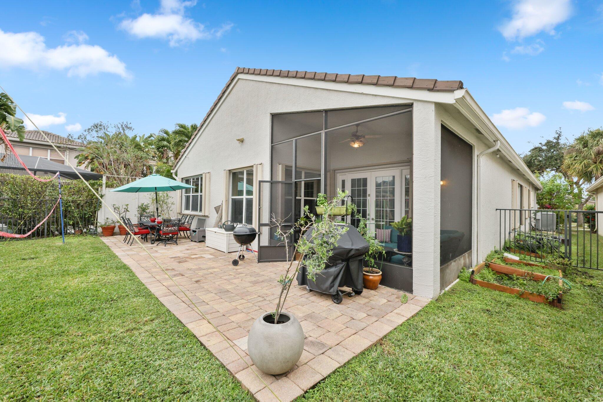 19090 Skyridge Circle Boca Raton, FL 33498 - Photo 39 of 70 a view of an house with backyard space and garden