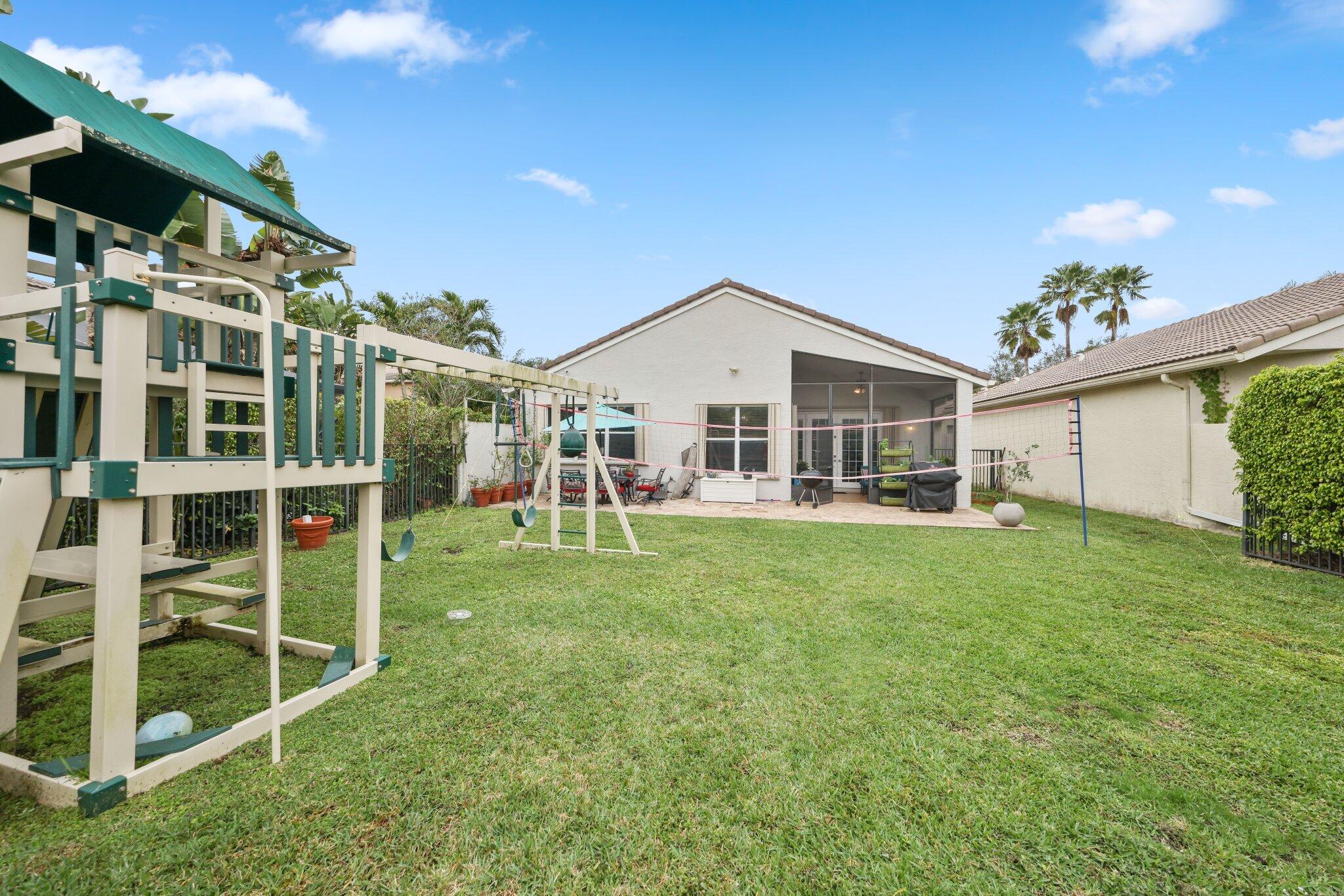 19090 Skyridge Circle Boca Raton, FL 33498 - Photo 46 of 70 a view of a house with backyard and porch