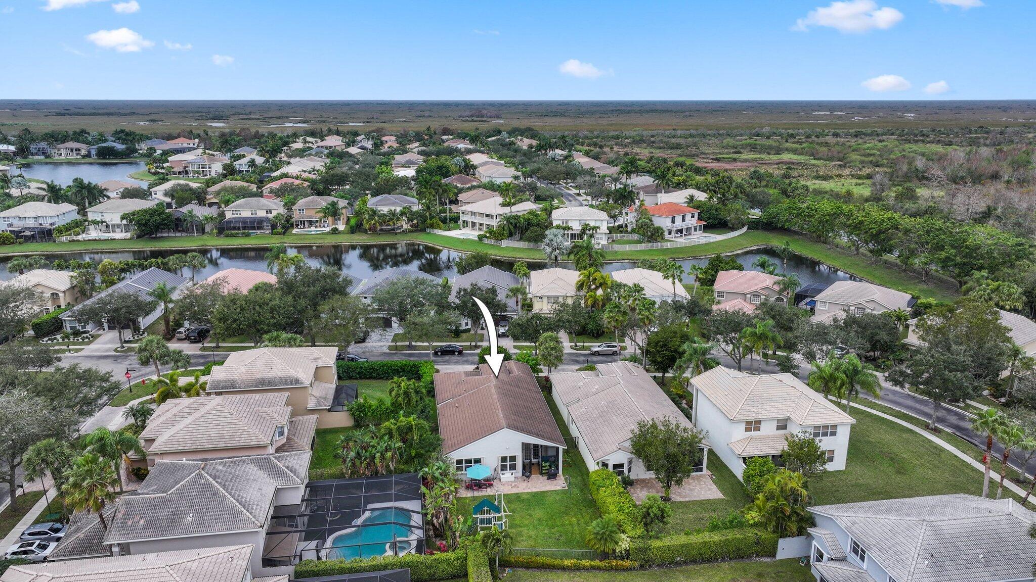 19090 Skyridge Circle Boca Raton, FL 33498 - Photo 52 of 70 an aerial view of residential houses with outdoor space and lake view