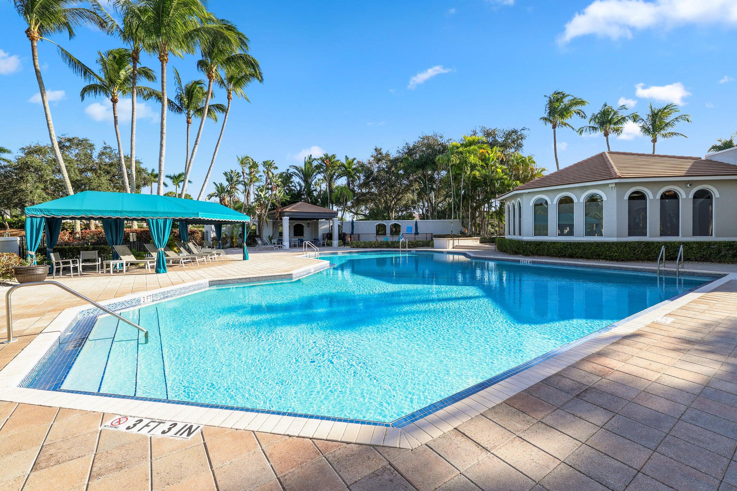19090 Skyridge Circle Boca Raton, FL 33498 - Photo 64 of 70 a view of a patio with swimming pool table and chairs