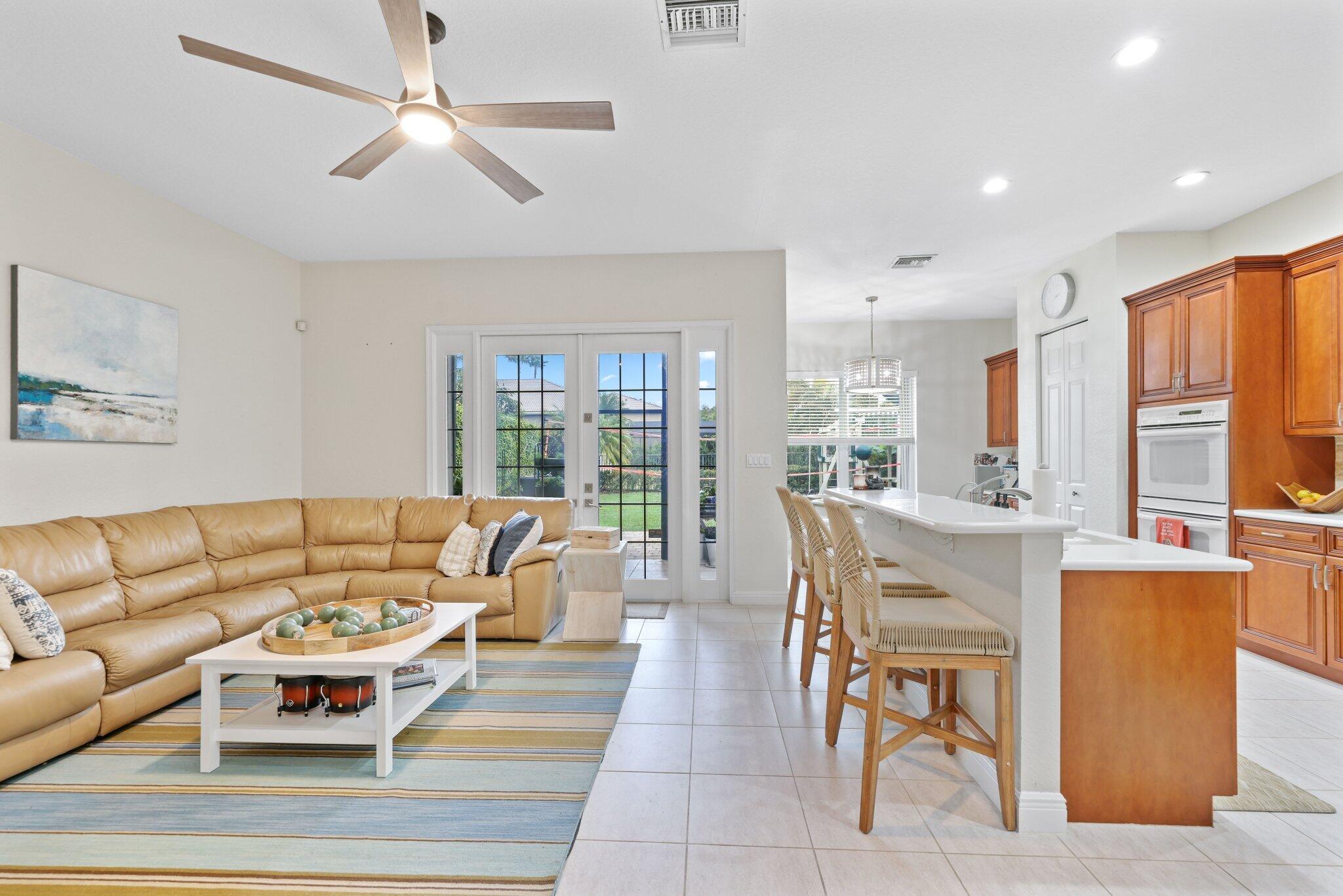 19090 Skyridge Circle Boca Raton, FL 33498 - Photo 9 of 70 a living room with fireplace furniture and a large window