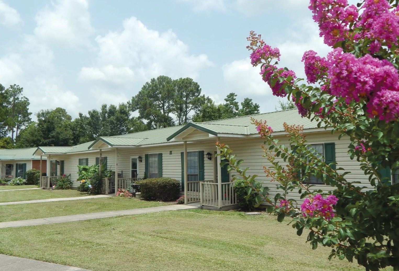 24598 Gulf Bay Road Other, AL 36561 - Photo 4 of 6 a front view of a house with a garden