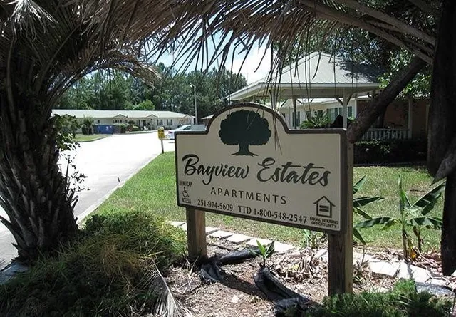 a view of a sign board and yard