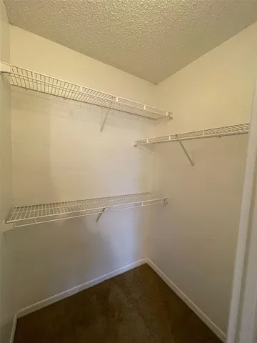 a view of a room with racks on the wall