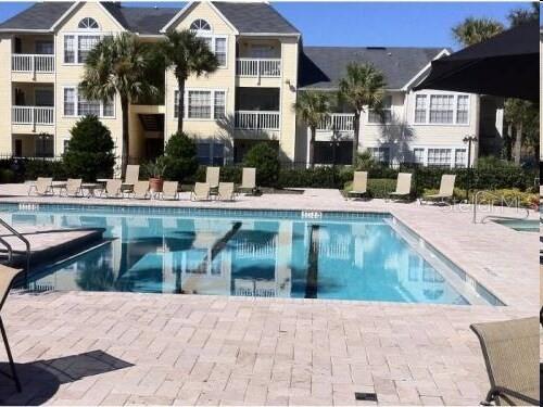 1063 South Hiawassee Road, Unit 1624 Orlando, FL 32835 - Photo 15 of 20 a view of house with outdoor space and swimming pool