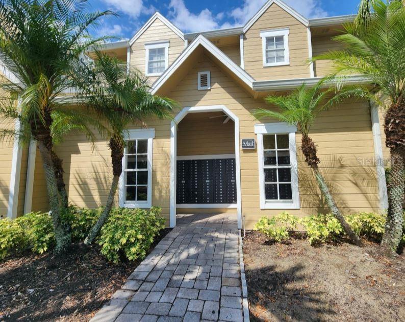 1063 South Hiawassee Road, Unit 1624 Orlando, FL 32835 - Photo 18 of 20 a front view of a house with a yard and garage
