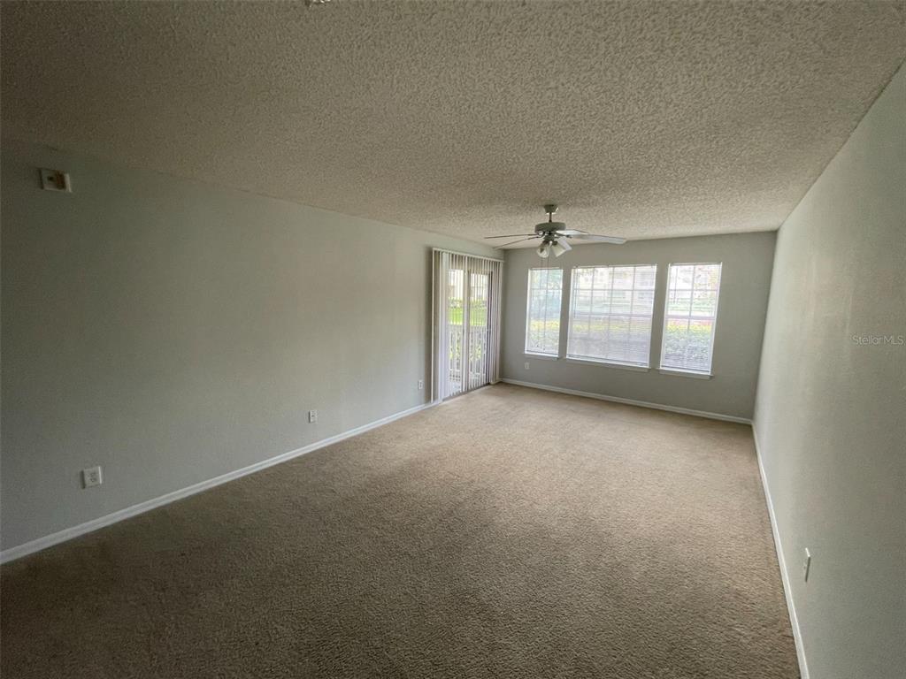 1063 South Hiawassee Road, Unit 1624 Orlando, FL 32835 - Photo 4 of 18 an empty room with windows