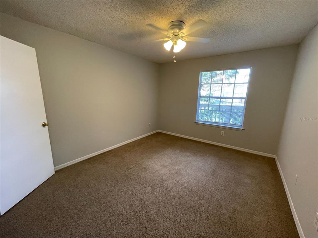 1063 South Hiawassee Road, Unit 1624 Orlando, FL 32835 - Photo 9 of 18 an empty room with a window