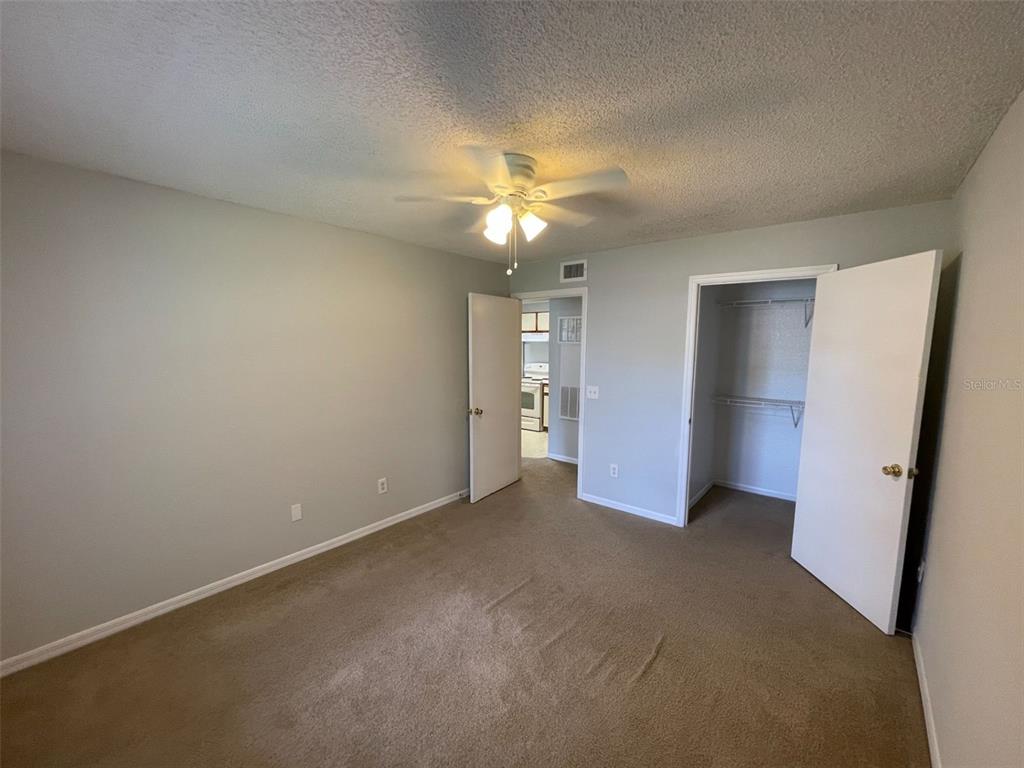 1063 South Hiawassee Road, Unit 1624 Orlando, FL 32835 - Photo 10 of 18 a view of an empty room with a ceiling fan