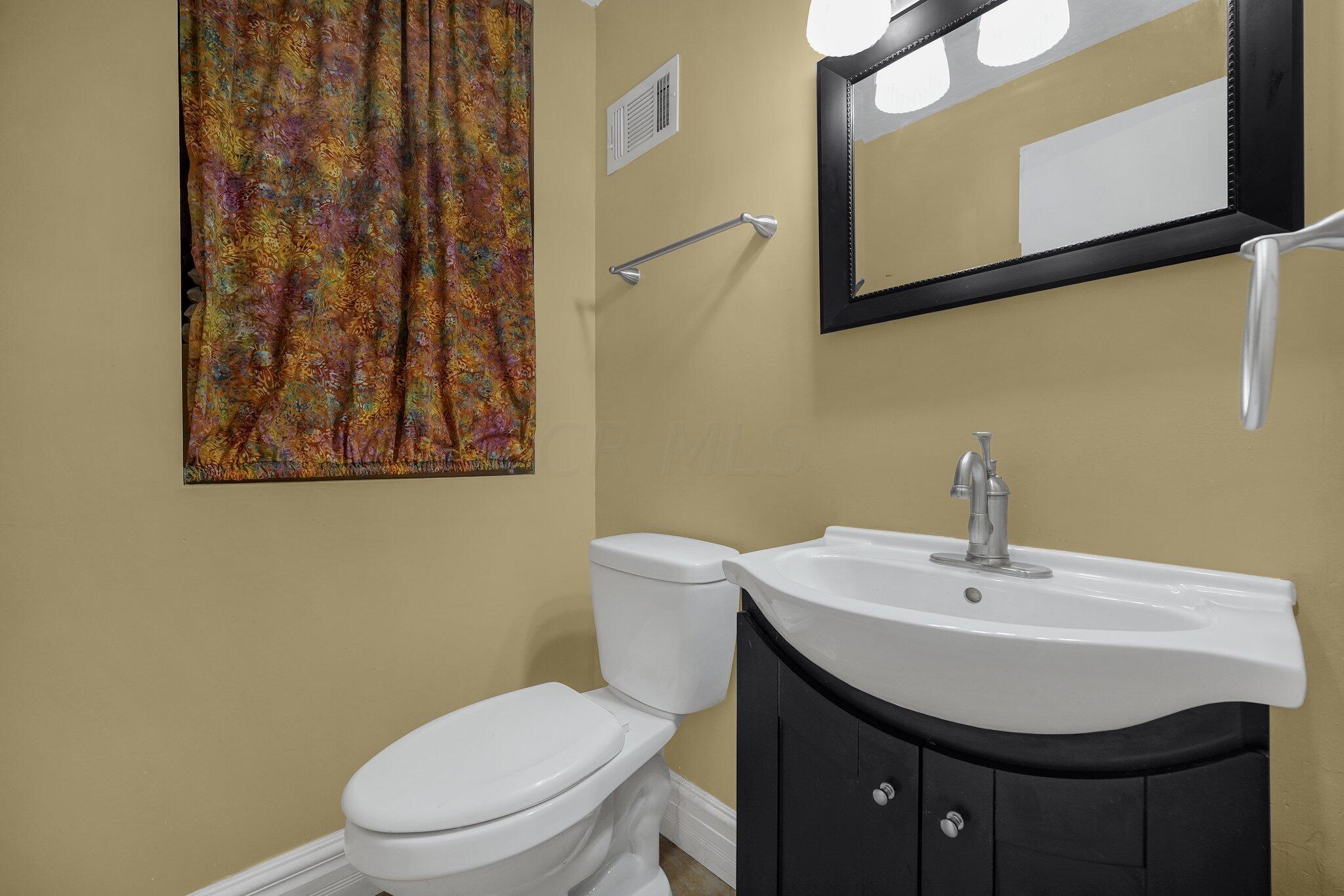 563 McCutcheon Road Columbus, OH 43230 - Photo 21 of 27 Half bath off the laundry room!