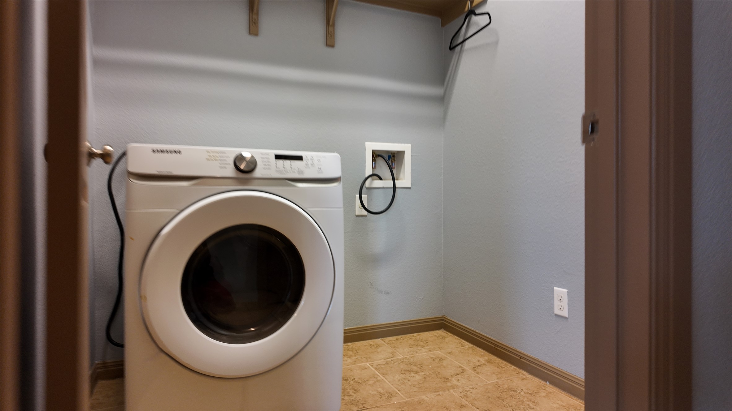 1601 Nelson Ranch Loop Cedar Park, TX 78613 - Photo 14 of 25 Laundry area with washer / dryer and baseboards