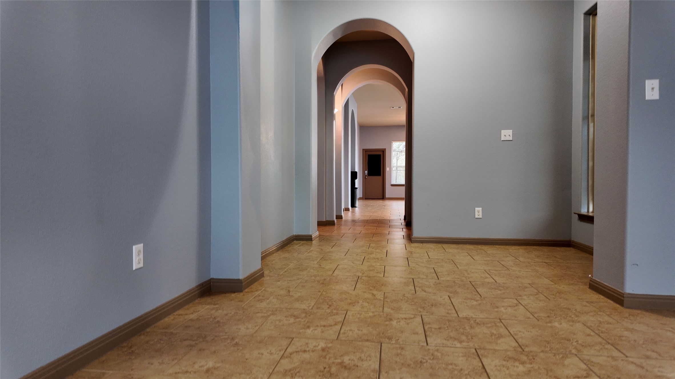 1601 Nelson Ranch Loop Cedar Park, TX 78613 - Photo 5 of 25 Hall featuring arched walkways and baseboards