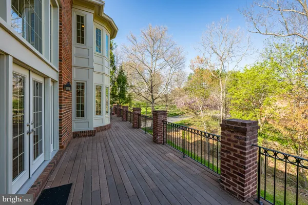 a view of a house with wooden deck