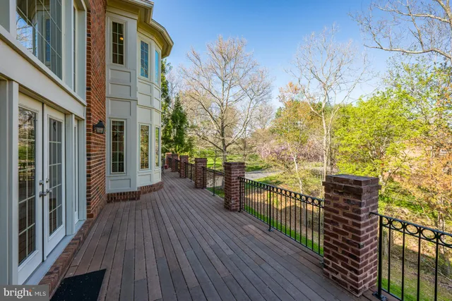 a view of a house with wooden deck