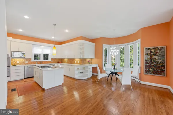 a large kitchen with lots of counter space and windows