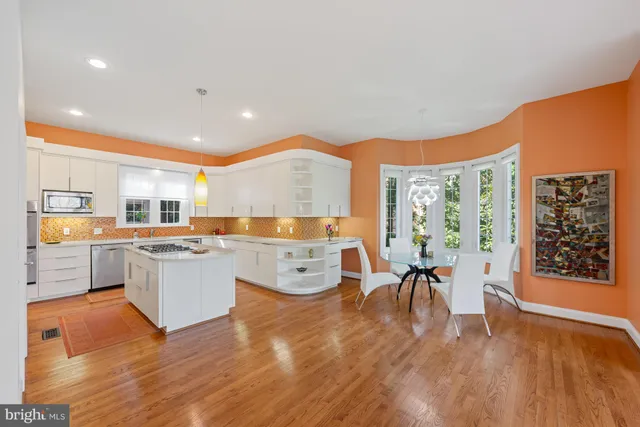a large kitchen with lots of counter space and windows