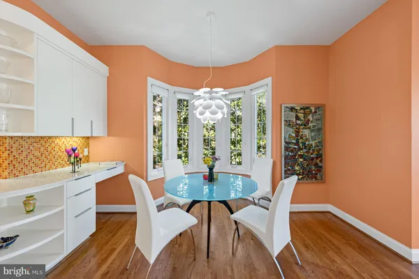 a dining room with furniture and window
