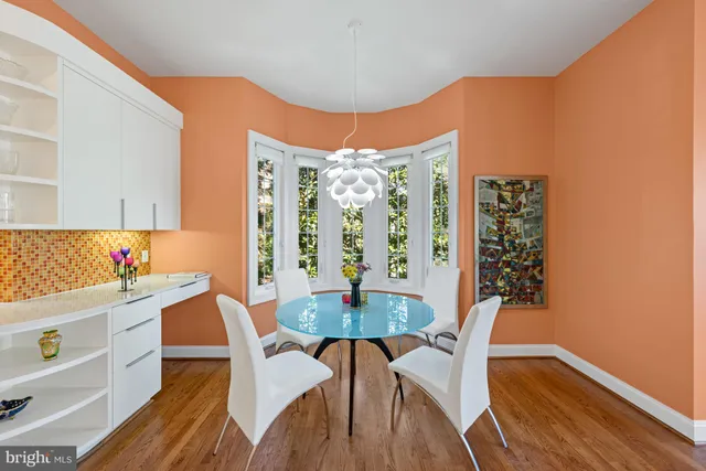 a dining room with furniture and window