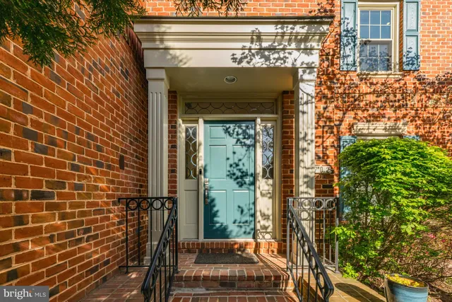 a view of a door of a house with a street