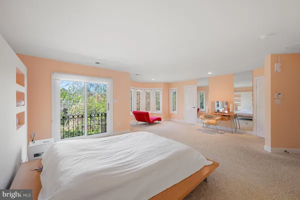 a large room with a window and furniture